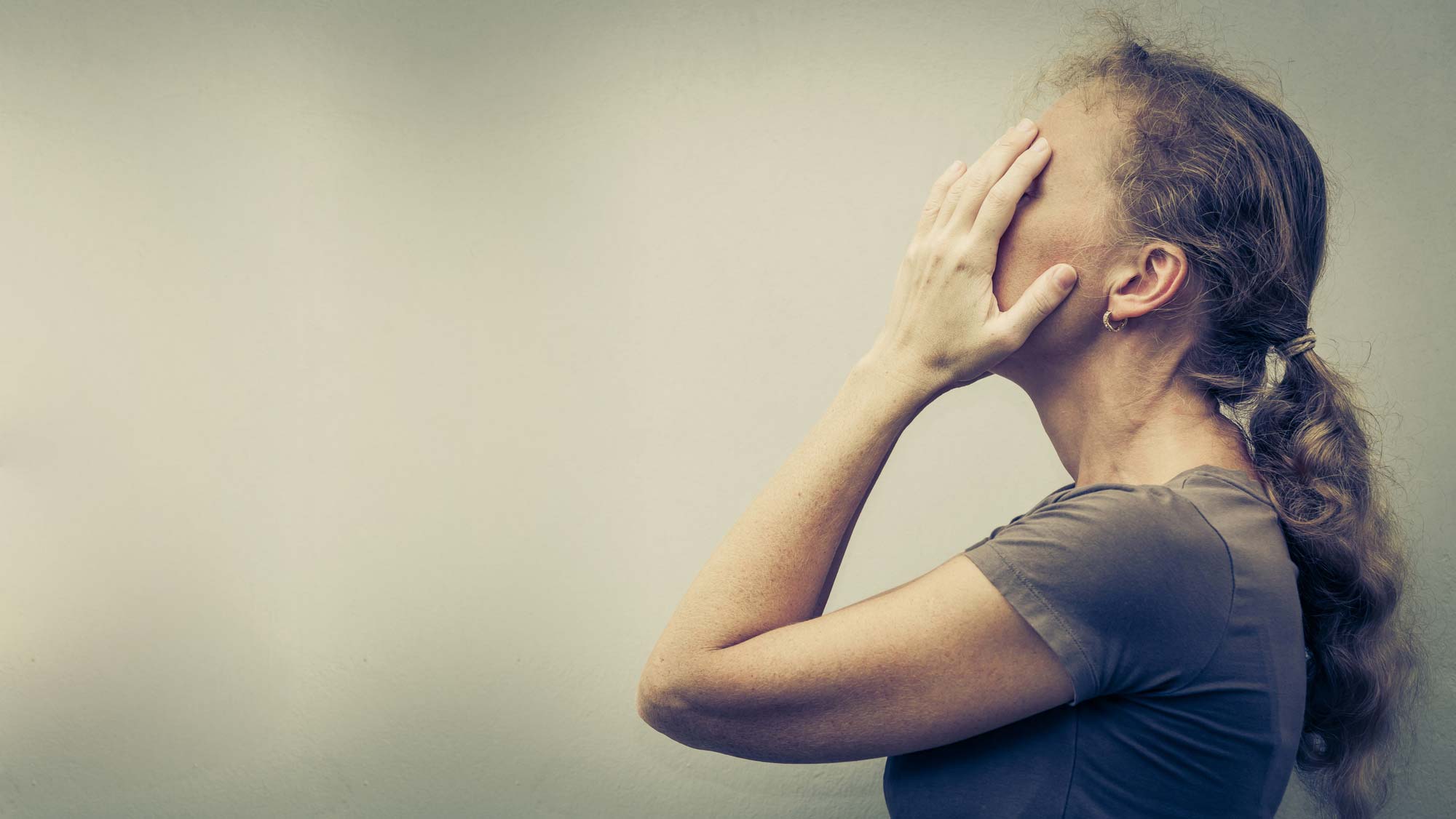 woman-holding-face